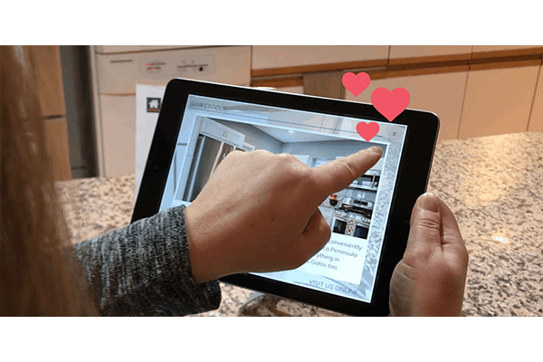 Our augmented reality application gives homebuilders valuable audience insights. Pictured: The Home Walkthrough app lets users like products.
