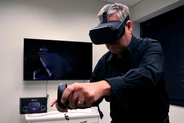 a woman with a vr headset on a red background