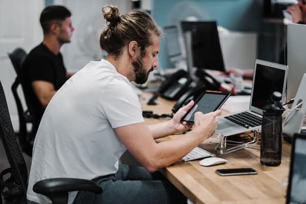 A man working on iOS applications for iPad